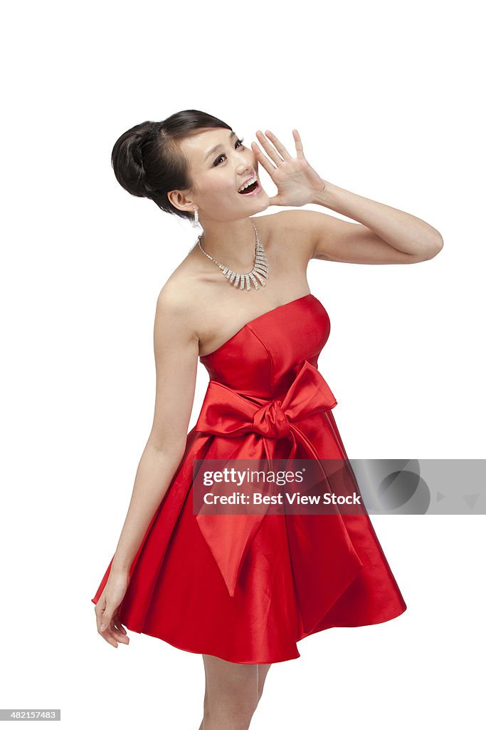 Studio shot young woman in evening dress