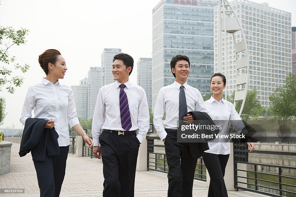 A group of businessmen outside the office building