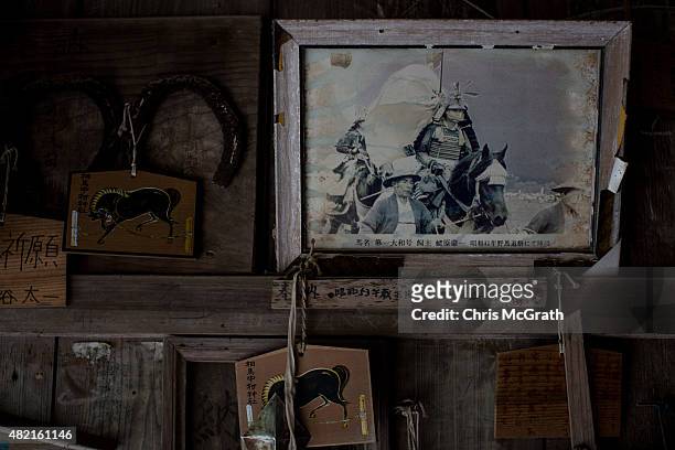 An old samurai photograph is seen hanging on the Nakamura Shrine wall on July 24, 2015 in Minamisoma, Japan. Every summer the people of Fukushima...