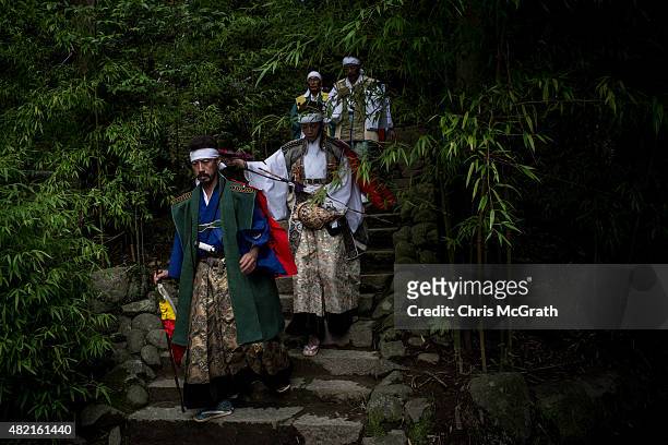 Samurai horseman walks down from the nakamura Shrine after taking part in a ritual ahead of the Soma Nomaoi festival on July 24, 2015 in Minamisoma,...