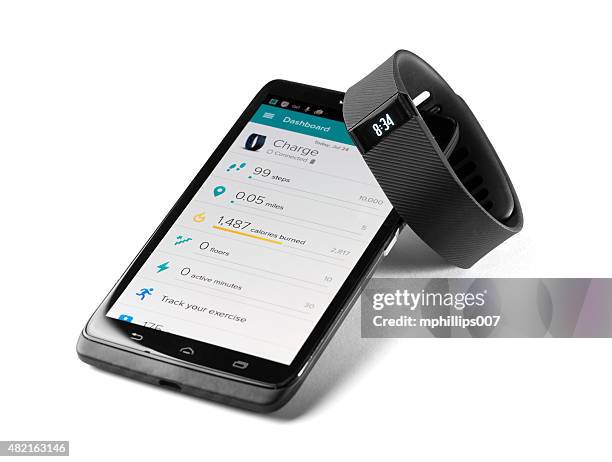 fitbit charge with smartphone app - fitbit stock pictures, royalty-free photos & images