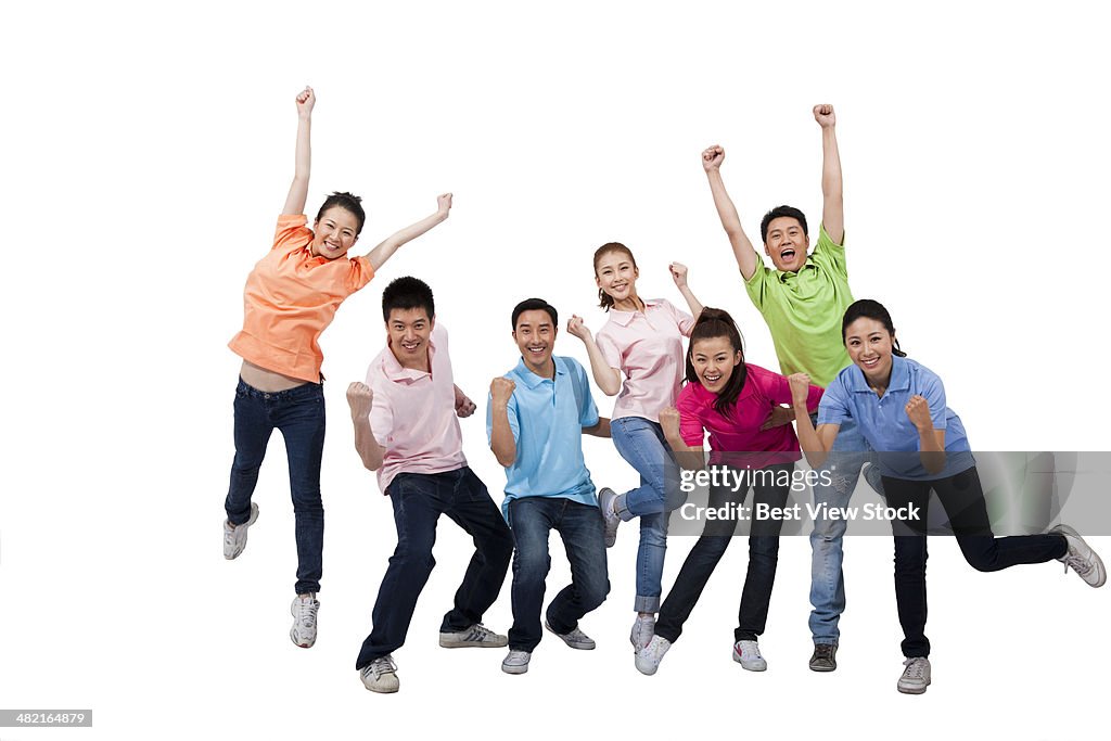 A group of young people jumping