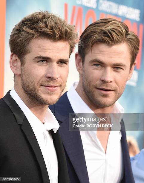 Actors Liam Hemsworth and Chris Hemsworth arrive for the premiere of Warner Bros' "Vacation" at the Regency Village Theatre in Los Angeles on July...