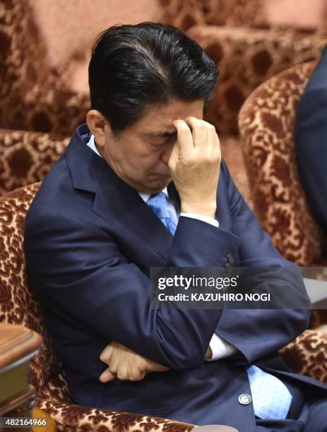 Japan's Prime Minister Shinzo Abe attends an upper house special committee session at the parliament in Tokyo on July 28, 2015. The upper house...