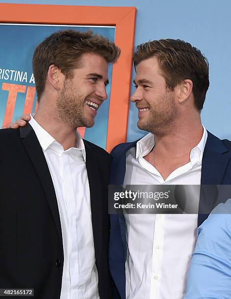 Actors Liam Hemsworth and Chris Hemsworth attend the premiere of Warner Bros. Pictures "Vacation" at Regency Village Theatre on July 27, 2015 in...