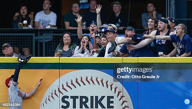 Left fielder Ender Inciarte of the Arizona Diamondbacks makes a leaping catch at the wall on a ball off the bat of Mike Zunino of the Seattle...