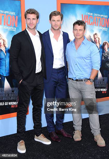 Actors/brothers Liam Hemsworth, Chris Hemsworth and Luke Hemsworth arrive at the Premiere Of Warner Bros. 'Vacation' at Regency Village Theatre on...