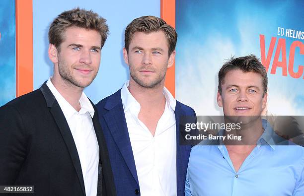Actors/brothers Liam Hemsworth, Chris Hemsworth and Luke Hemsworth arrive at the Premiere Of Warner Bros. 'Vacation' at Regency Village Theatre on...