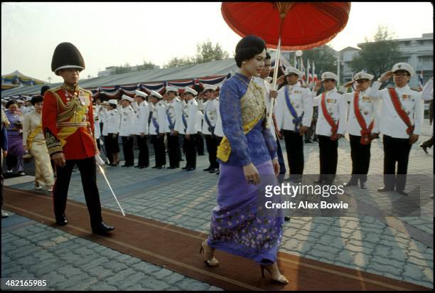 Queen Sirikit and son, Crown Prince Maha Vajiralongkorn, seen during celebrations marking the 180th Commemoration of the Birth of King Mongkut ,...