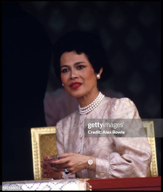 Queen Sirikit seen during the visit to Thailand of Malcolm Forbes at the launch of a 90-foot-tall elephant-shaped balloon in the showgrounds beside...