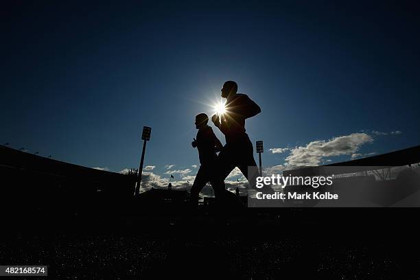 Daniel Hannebery and Rhyce Shaw run during a Sydney Swans AFL training session at the Sydney Cricket Ground on July 28, 2015 in Sydney, Australia.