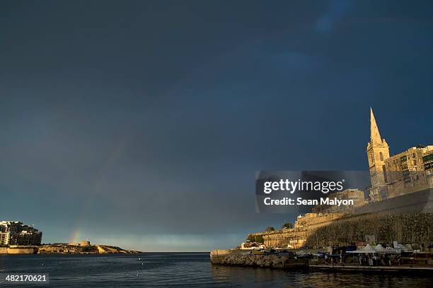 rainbow between valletta and sliema, malta - sean malyon stockfoto's en -beelden