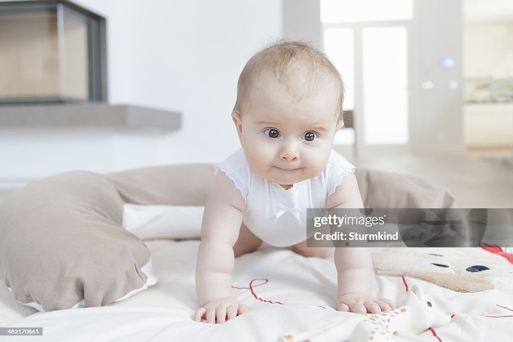 Baby crawling on floor