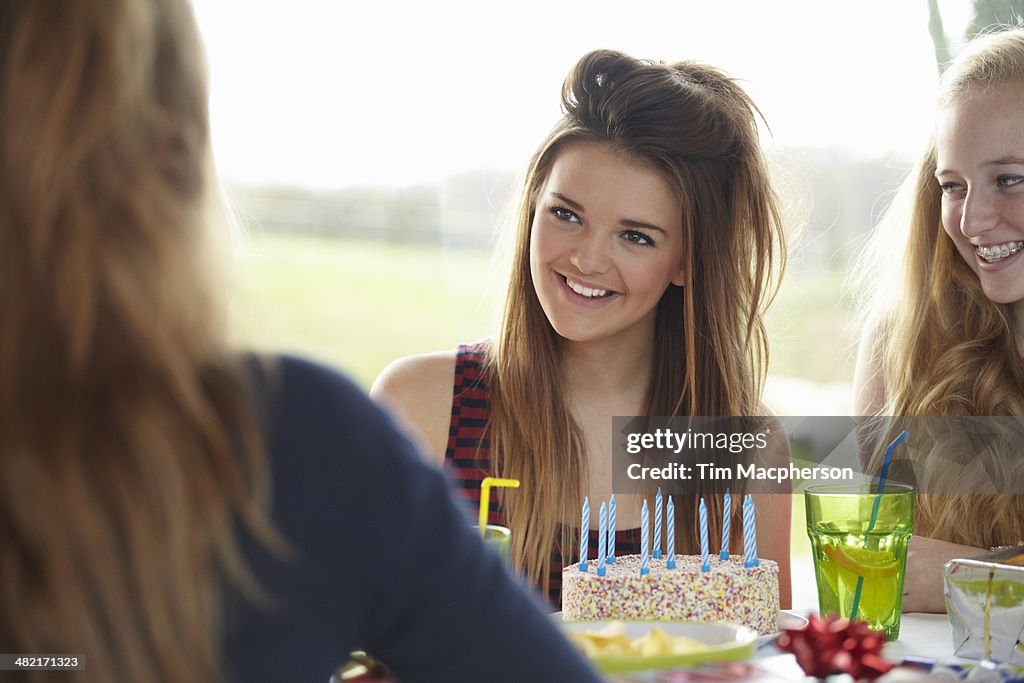 Teenage girl and friends enjoying birthday