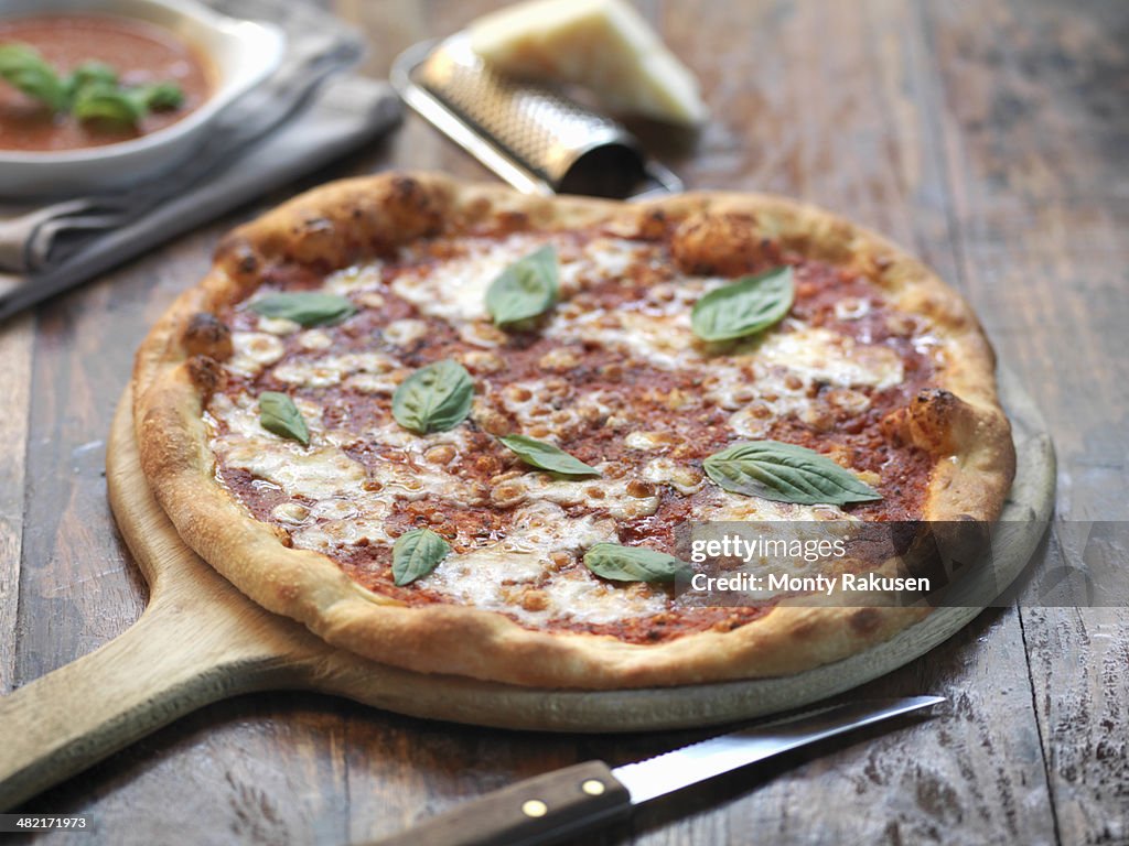 Homemade margherita pizza with mozzarella cheese and fresh basil
