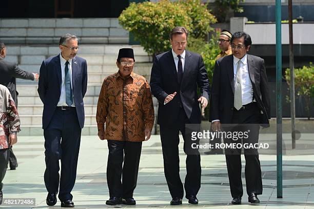 Britain's Prime Minister David Cameron , accompanied by British Ambasador to Indonesia Moazzam Malik , Aksa Mahmud , the head of the religious board...
