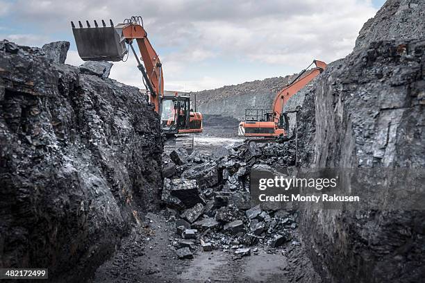 ancient deep coal workings in surface coal mine - graben körperliche aktivität stock-fotos und bilder