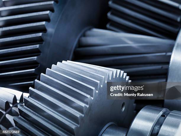 close up of gears in industrial gearbox - machine part stock pictures, royalty-free photos & images