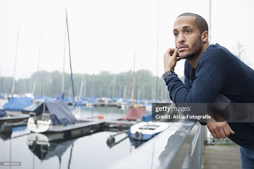 Portrait of young man in marina