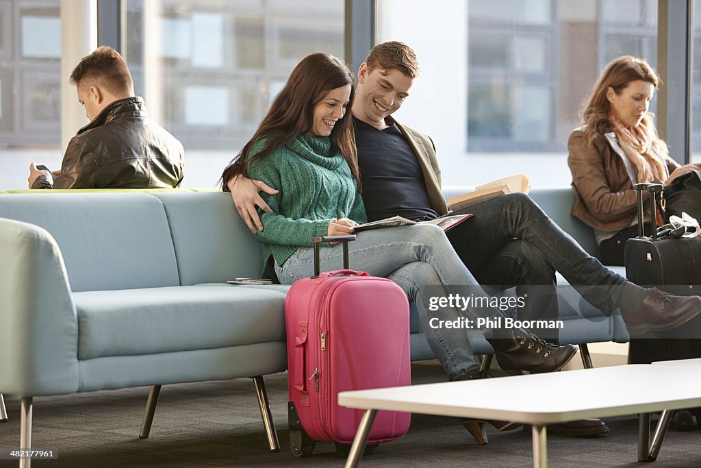 Young couple in departure lounge