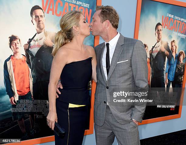 Actress Christina Applegate and her husband musician Martyn LeNoble arrive at the premiere of Warner Bros. Pictures' "Vacation" at the Village...