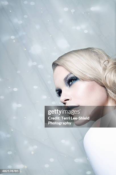 woman against glittery background - ice maiden stock pictures, royalty-free photos & images