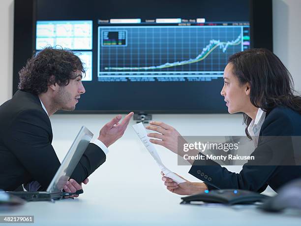 business colleagues in meeting in front of screen in office - south ruislip stock pictures, royalty-free photos & images