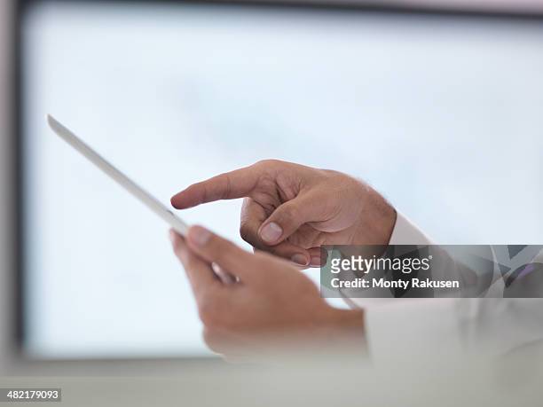 businessman using digital tablet, close up - south ruislip stock pictures, royalty-free photos & images