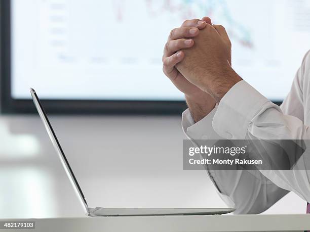 businessman in meeting using laptop, close up - south ruislip stock pictures, royalty-free photos & images