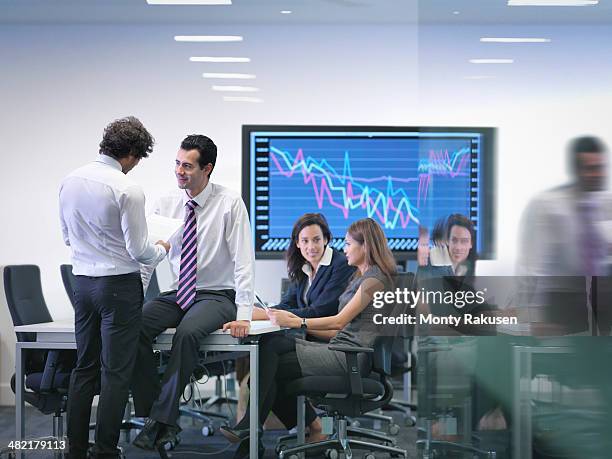 office colleagues in informal meeting - south ruislip stock pictures, royalty-free photos & images