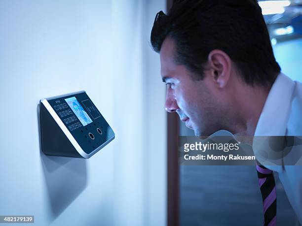 businessman using face recognition system for office security - biometrics stockfoto's en -beelden