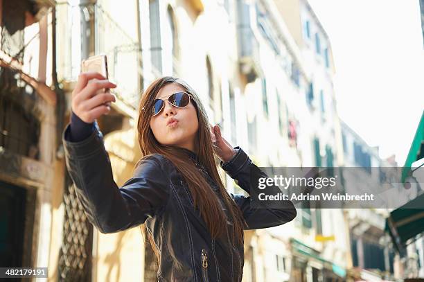 girl taking selfie on smartphone, venice, italy - tourist selfie stock pictures, royalty-free photos & images