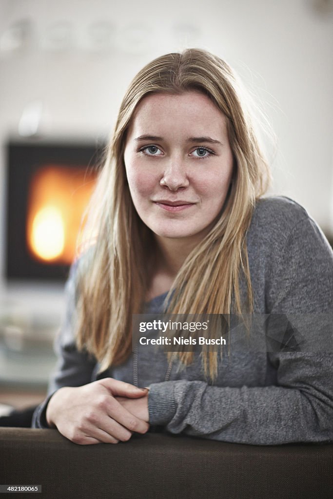 Portrait of teenage girl smiling apprehensively