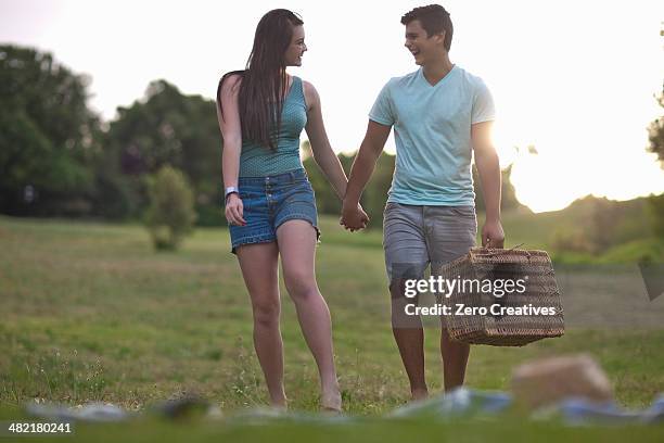 teenage couple going for picnic in forest - durbanville stock pictures, royalty-free photos & images