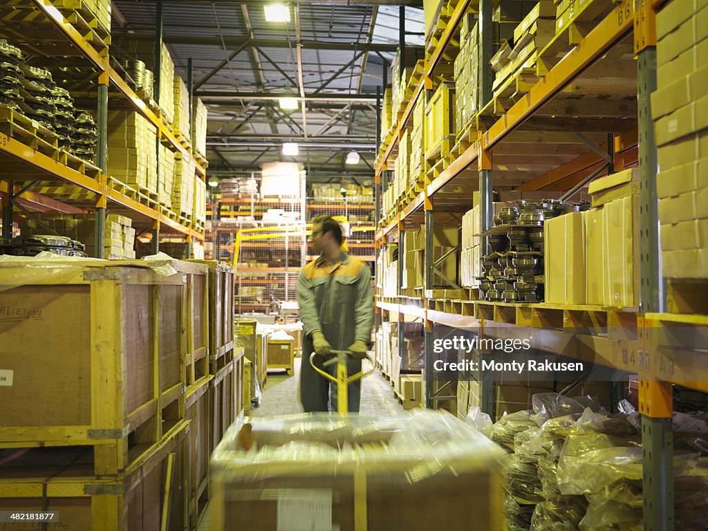 Worker in storage area of factory