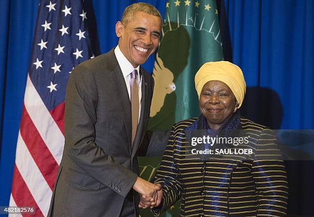 African Union Chairperson Nkosazana Dlamini Zuma shakes hands with US President Barack Obama during a meeting at the African Union Headquarters in...