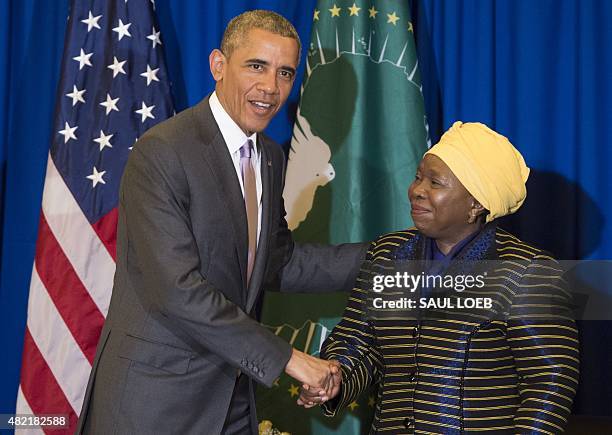 African Union Chairperson Nkosazana Dlamini Zuma shakes hands with US President Barack Obama during a meeting at the African Union Headquarters in...