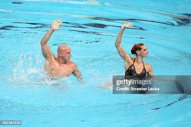 Virginie Dedieu and Benoit Beaufils of France compete in the Mixed Duet Free Synchronised Swimming Preliminary on day four of the 16th FINA World...