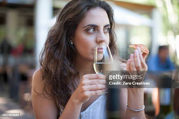 young woman smelling wine at vineyard bar - wine bar stock pictures, royalty-free photos & images
