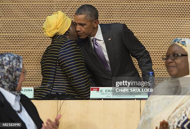 President Barack Obama embraces African Union Chairperson Nkosazana Dlamini Zuma , after delivering a speech about security, economic issues and...