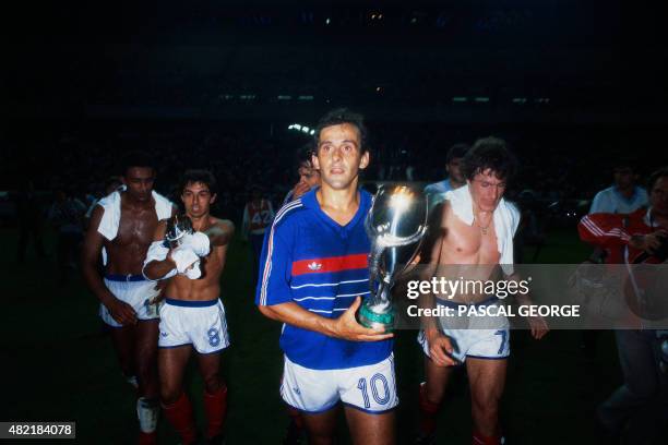 French player and capitan Michel Platini , followed by Football players of France Jose Toure , Alain Giresse and Luis Fernandez holds on August 21,...