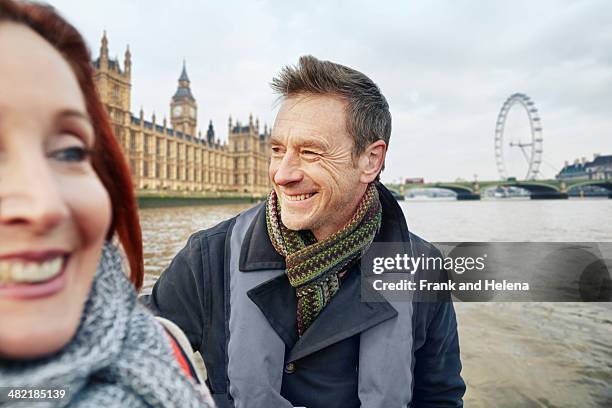 mature couple sightseeing, london, uk - millennium wheel imagens e fotografias de stock