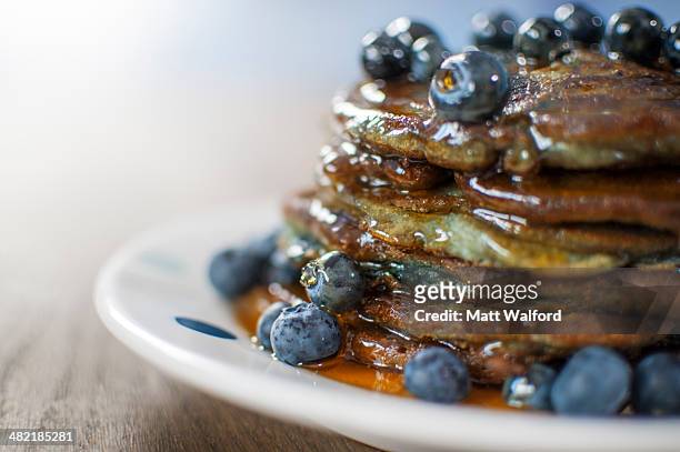 still life of blueberry pancakes with maple syrup - maple syrup pancakes stock pictures, royalty-free photos & images