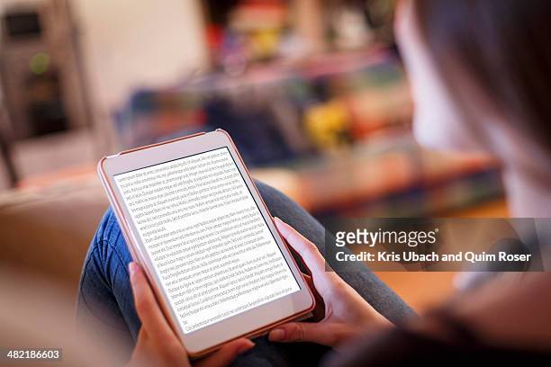 young woman using digital tablet - e reader stock-fotos und bilder