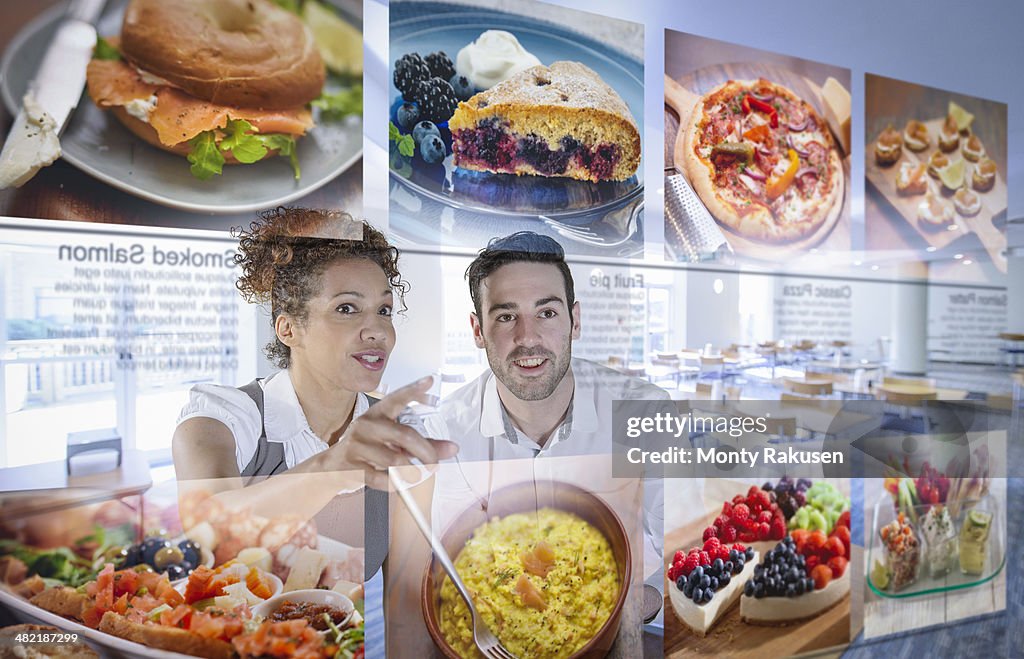 Customers choosing food from interactive display in office canteen