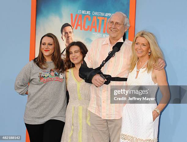 Emily Evelyn Chase, Caley Leigh Chase, actor Chevy Chase and wife Jayni Chase arrive at the Premiere Of Warner Bros. 'Vacation' at Regency Village...