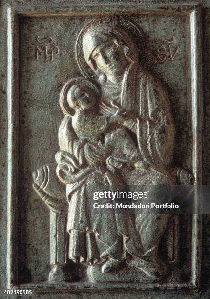 Italy, Puglia, Trani, Cathedral of Saint Nicholas Pilgrim. Whole artwork view. Marble relief depicting a Madonna with Child in a shaped frame.