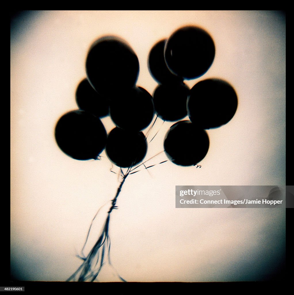 Black balloons floating