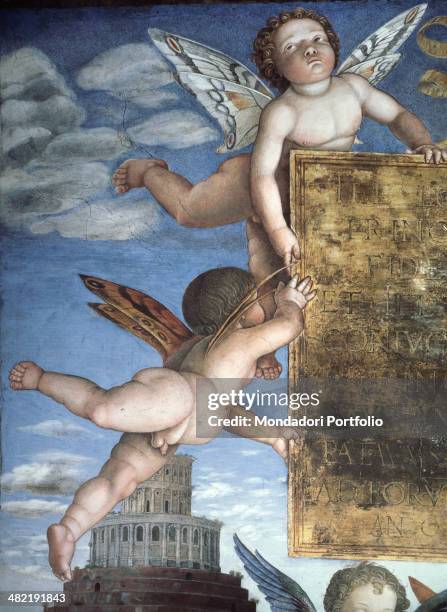 Italy, Lombardy, Mantua, Ducale Palace. Detail. Putti with butterfly wings hold a plate; a Renaissance building with a central map in the background.