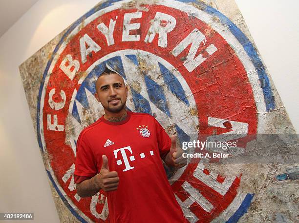 Chilean midfielder Arturo Vidal poses for photographer after he signed his contract with FC Bayern Munich on July 28, 2015 in Munich, Germany.